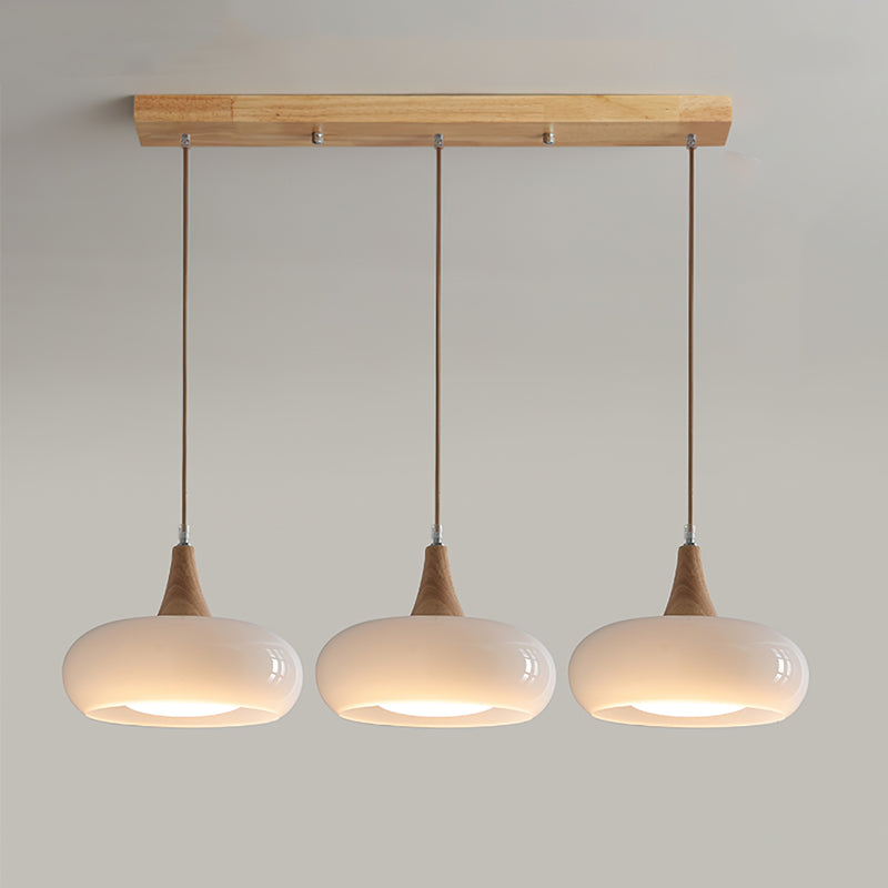 Elowara | Lampada a Sospensione in Vetro Ambra con Dettagli in Legno per Illuminazione Ambientale nella Sala da Pranzo